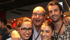 Television presenter David Koch, wearing glasses, and son AJ Koch with his sisters Georgie and Brie at a basketball game in 2017. 