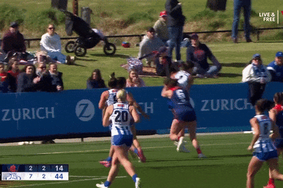 Libby Birch is heavily tackled by her former teammate.