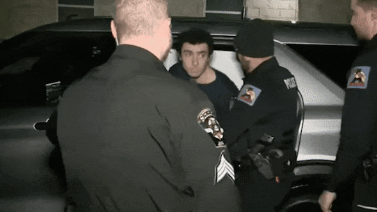 Luigi Mangione is taken into  court.