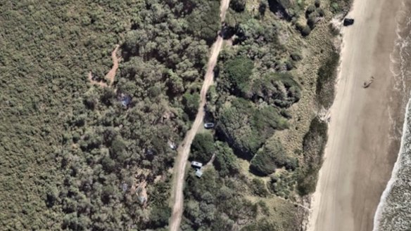 An aerial shot of the sprawling squat at Seven Mile Beach, taken in April 2025.