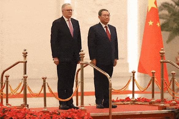 Anthony Albanese and Li Qiang inspect troops in Beijing on Tuesday.