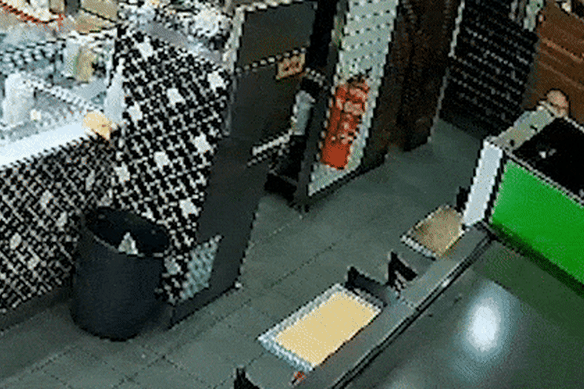 Samimjan Azari shields himself with a chair as the gunman opens fire in a Turkish restaurant in Auburn.