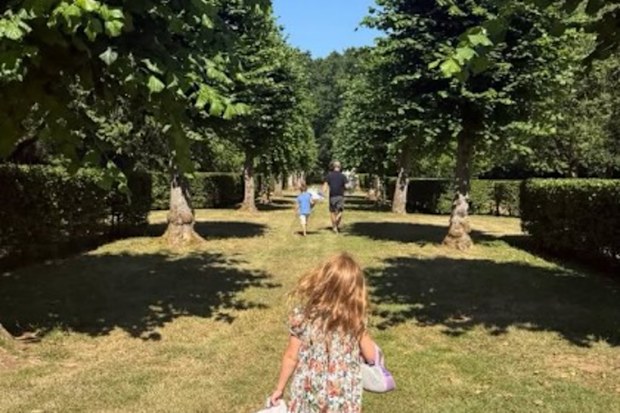 Meghan Duchess of Sussex has shared a photo of Prince Harry, Archie and Lilibet appearing to take photos to visit the grave of Princess Diana.