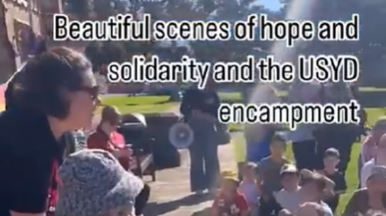 Children led chants using megaphones.