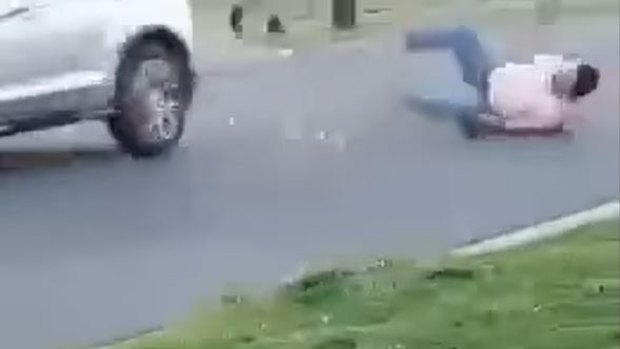 Dramatic footage shows a man hit by a car during a wild street brawl west of Brisbane. 