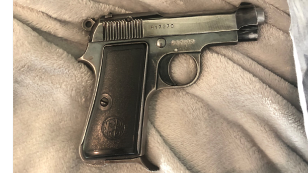 Federal police discovered the Beretta brand pistol under a pillow in the Docklands apartment in 2019.