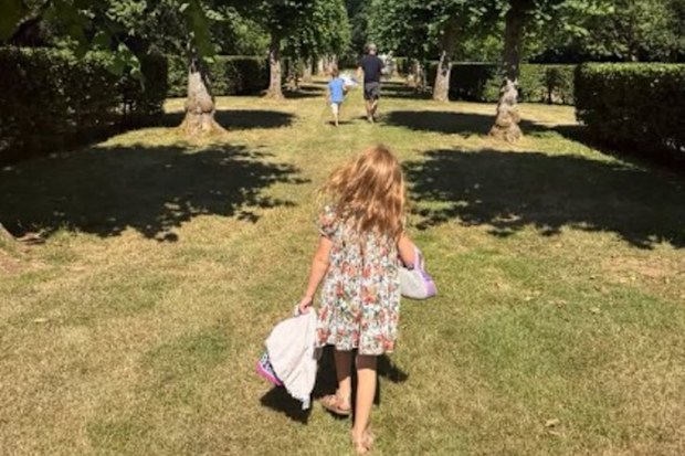 Meghan Duchess of Sussex has shared a photo of Prince Harry, Archie and Lilibet appearing to take photos to visit the grave of Princess Diana.