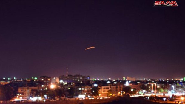 The Syrian state agency SANA released pictures of reported air defence systems intercepting missiles over Damascus on Saturday.