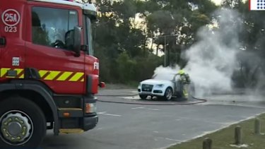 Firefighters put out the car fire shortly after the hit-run crash. 