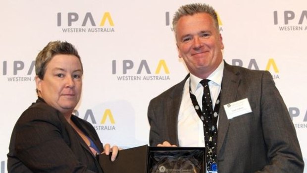 Department of Communities chief financial officer Liam Carren receives an an IPPA award recognising him as the "finance practitioner of the year".