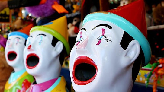 A young child checks out one of the sideshow alley games at the show.