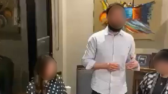 Screenshots of the man giving the speech at the gathering.