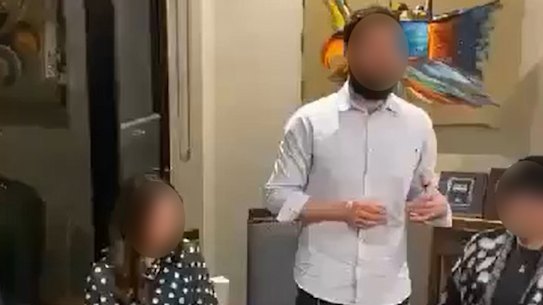 Screenshots of a man giving a speech at the gathering.