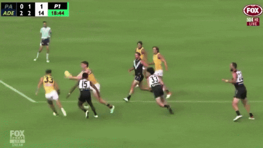 Sam Powell-Pepper collides with Adelaide’s Mark Keane, who was concussed in the incident.