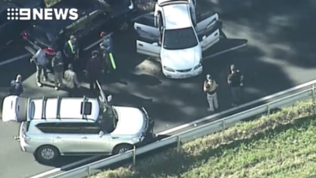Police shoot alleged gunman after wild chase closes Bruce Highway