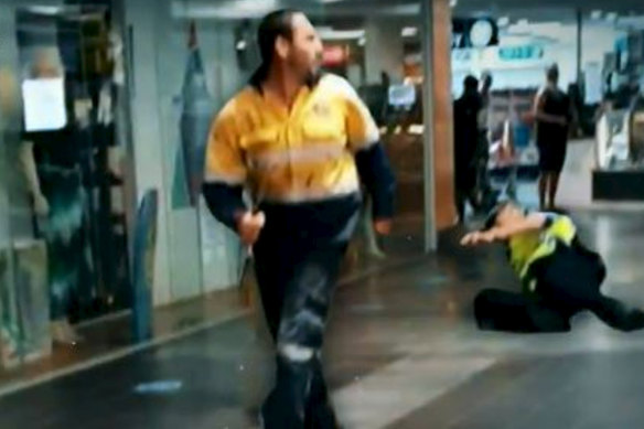 A horrified shopper photographed Ashley Fildes as he ran through South Hedland Square with a knife.