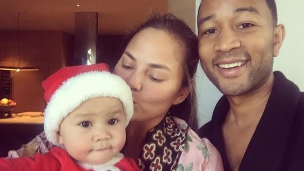  Chrissy Teigen at Christmas time with daughter Luna and husband  John.