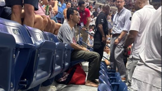 A protester glued his feet to the ground at Arthur Ashe Stadium.