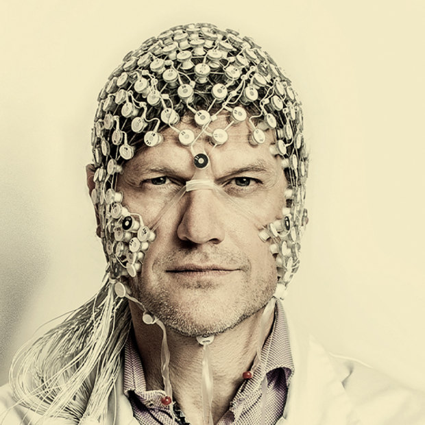 Neurologist Steven Laureys wearing an EEG, or electroencephalogram, used to test electrical activity in the brain.