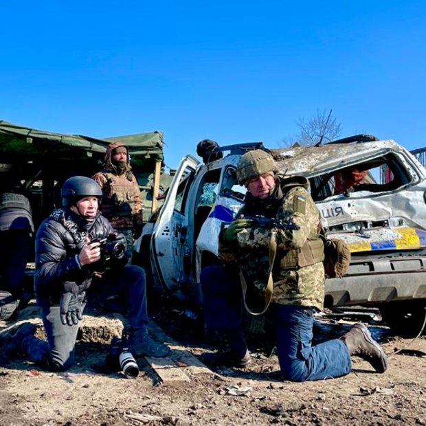 Darren Conway (left) filming on the frontline in Kharkiv.