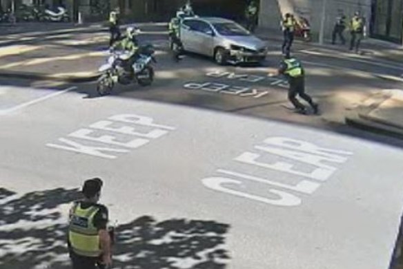 An image from CCTV showing police trying to stop Siyar Bagdas