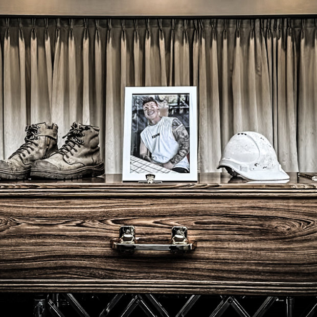 Ben Nash’s work gear rests atop his coffin. 