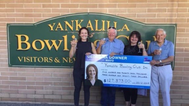 Liberal candidate Georgina Downer presents a cheque to the Yankalilla Bowling Club in February.
