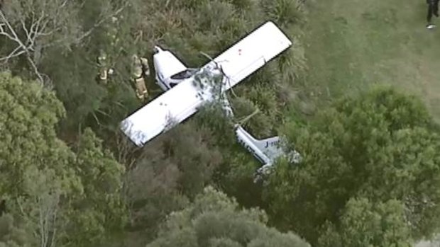 The light plane after it crashed on the golf course near Moorabbin Airport.
