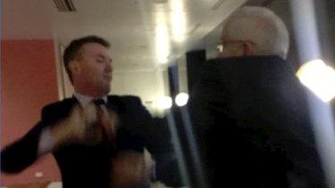 Hanson adviser James Ashby, left, and Senator Brian Burston in a physical altercation at  Parliament House. 