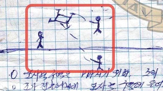 A drawing showing stick men figures shooting a drone, on one page of the North Korean soldier’s diary.