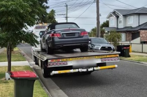 Police seize what they said is a stolen Mercedes from the Hadfield address.