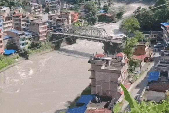 Floodwaters rage through the town of Nuwakot in Nepal.