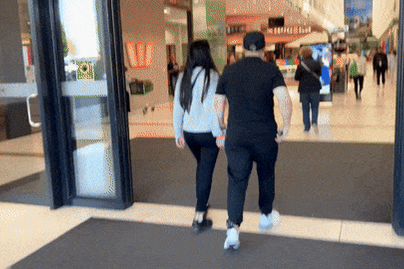 Tony Mokbel and a female companion strolled around Northland shopping centre on his first morning of freedom in almost two decades.