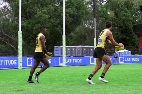 Maurice Rioli jnr and Daniel Rioli turn backflips.