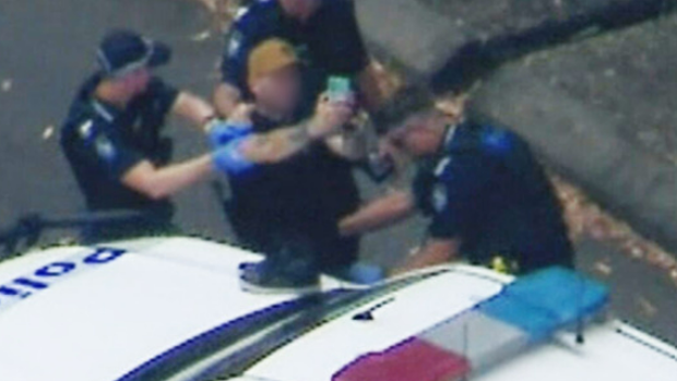 Man appears to take selfie during arrest after highway drama