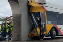 A bus driver has been seriously injured after crashing into a concrete rail bridge pylon in Port Adelaide.