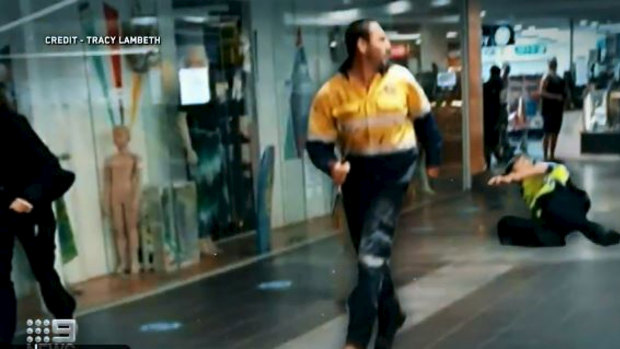 A horrified shopper photographed Ashley Fildes as he ran through South Hedland Square with a knife.