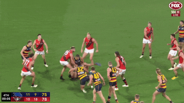 Crows players react with frustration after a holding the ball decision was not paid.