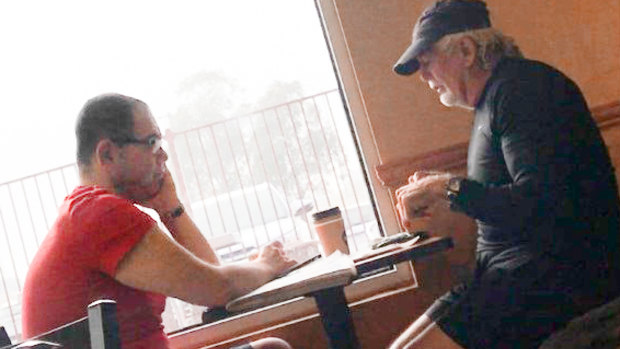 An IBAC surveillance photo of Casey councillor Sam Aziz (left) and developer John Woodman (right) at a Subway restaurant in April 2018. 