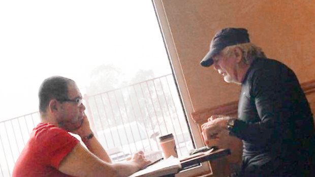 An IBAC surveillance photo of Casey councillor Sam Aziz (left) and developer John Woodman (right) at a Subway restaurant in April 2018. 