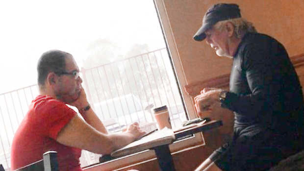 Casey councillor Sam Aziz (L) and developer John Woodman (R) meet at a Subway restaurant in April 2018. 
