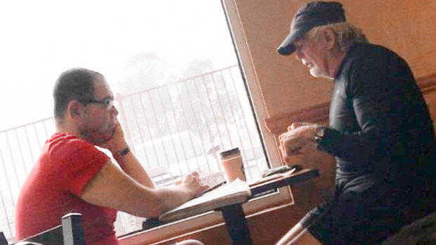An IBAC surveillance photo of Casey councillor Sam Aziz (L) and developer John Woodman (R) at a Subway restaurant in April 2018. 