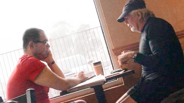 An IBAC surveillance photo of Casey councillor Sam Aziz (left) and developer John Woodman (right) at a Subway restaurant in April 2018. 