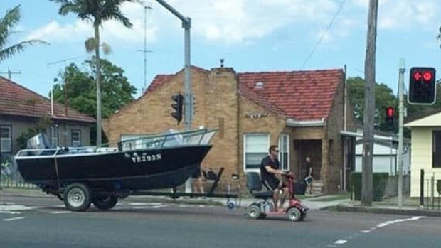 Man charged for using mobility scooter to tow boat down Pacific Highway