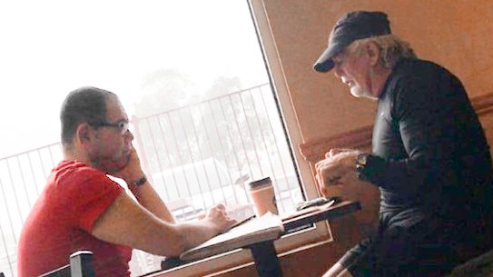 Casey councillor Sam Aziz (L) and developer John Woodman (R) meet at a Subway restaurant in April 2018. 