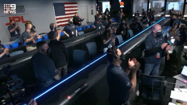 NASA’s control room celebrates after the Perseverance rover lands on Mars.