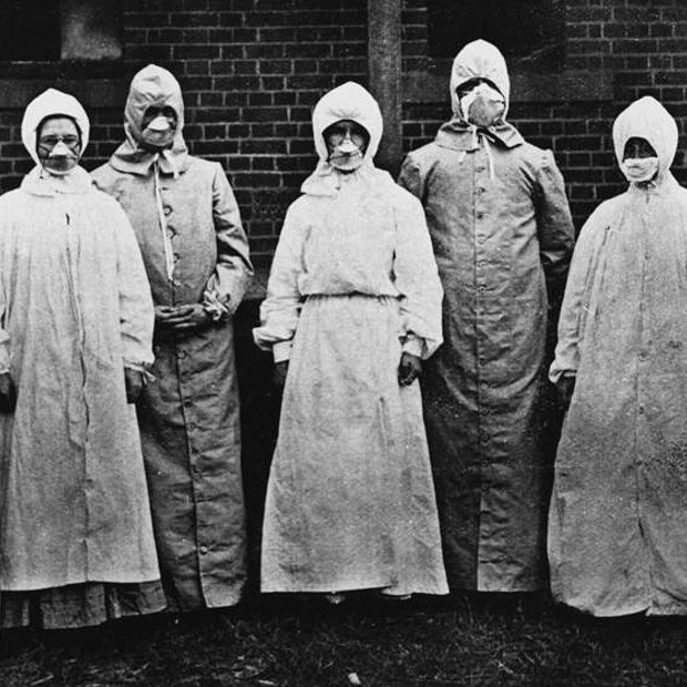 Dr Burnett Ham and his medical and nursing staff wore specially designed overalls and respirators when dealing with the sick.