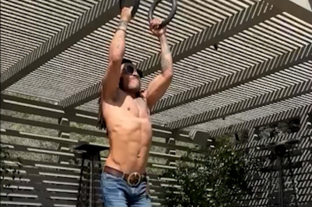 Lenny Kravitz working out in denim