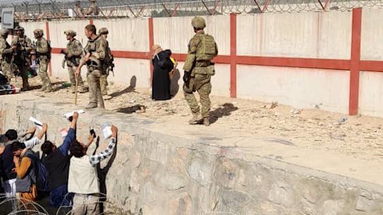 The situation just outside the airport is deteriorating. Afghans with Australian visas are being rejected at the gate.