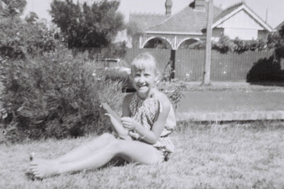 Elisabeth aged about eight on the grass outside her family’s Camberwell home.